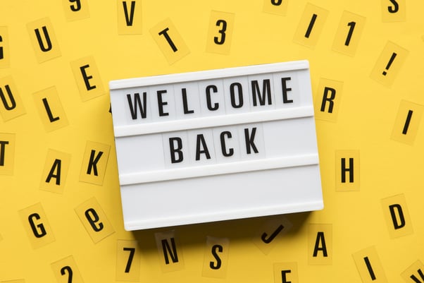 Sign saying welcome back